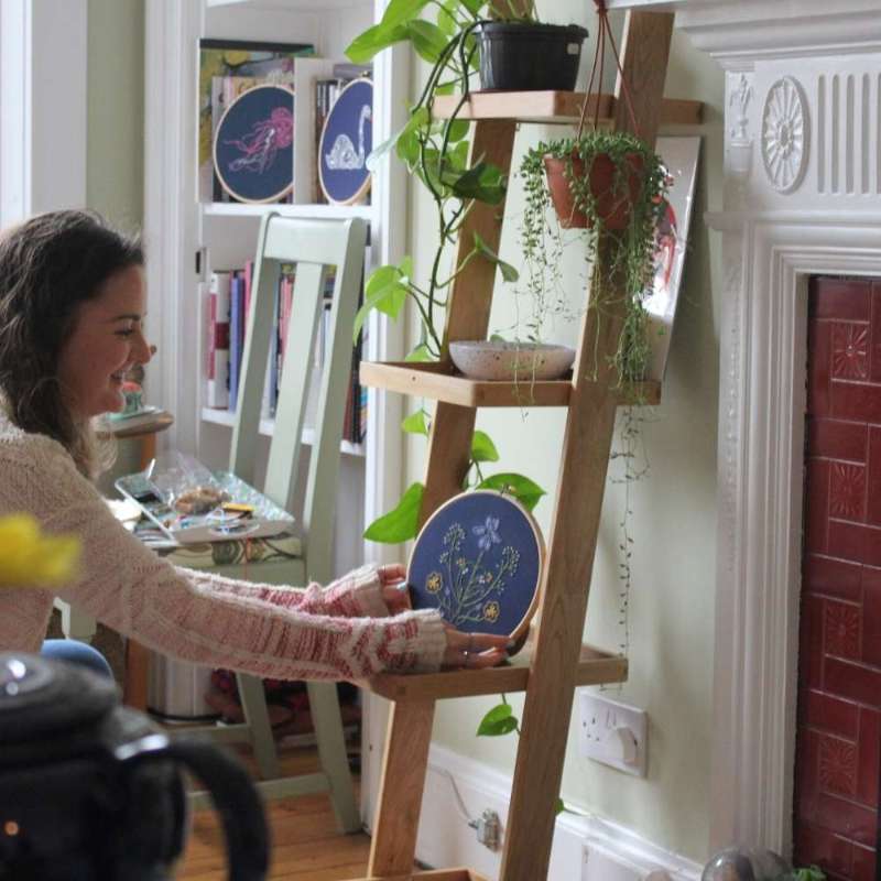 Botanical Embroidery kit being placed on shelf