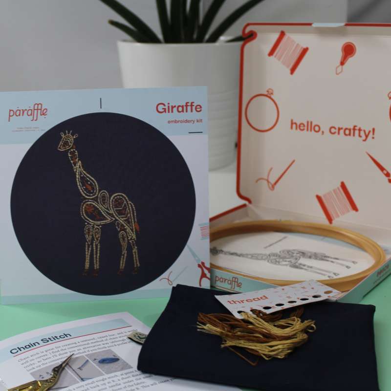 Photo showing the contents of the Giraffe tote bag embroidery kit