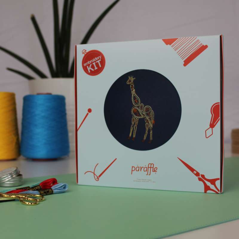 Photo showing the giftbox style packaging the Giraffe embroidery kit arrives in
